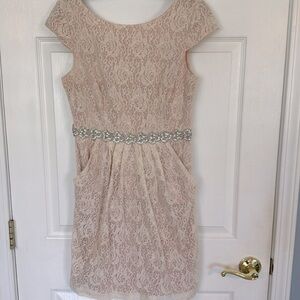 Beautiful champagne colored dress with pockets beading on waist, worn once